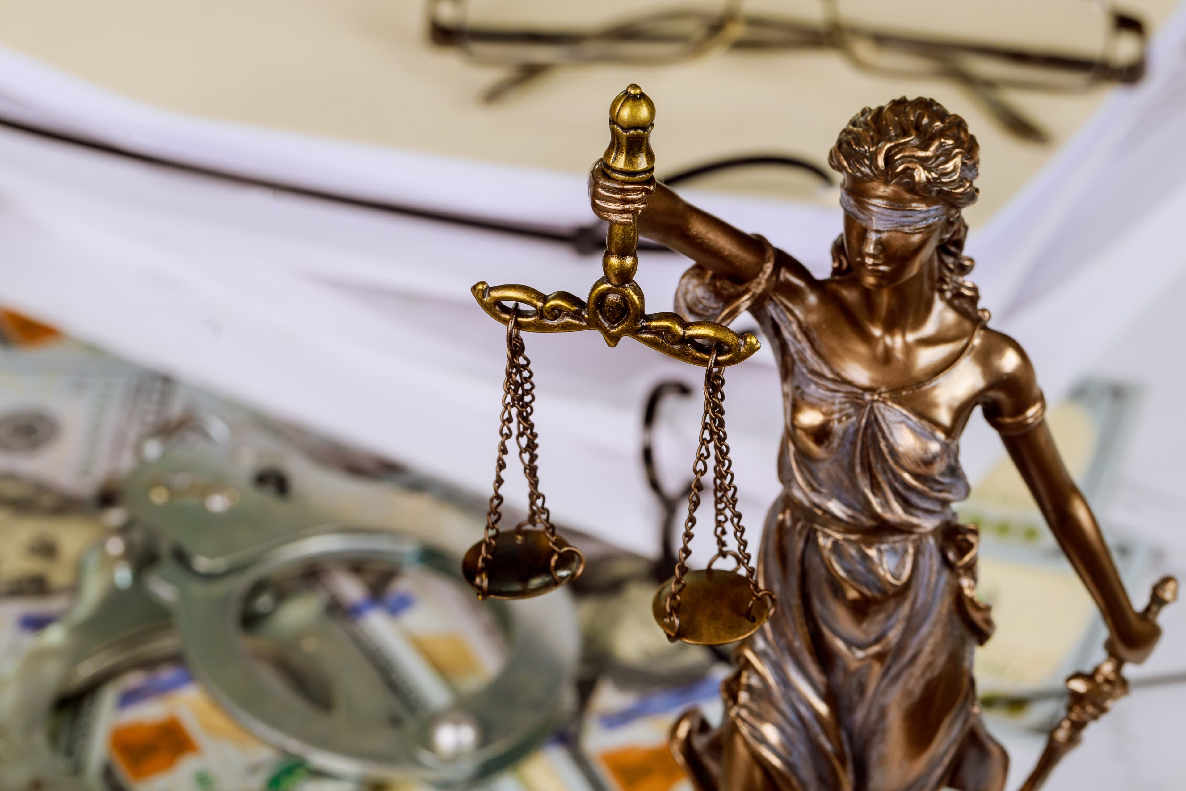 A person viewing a computer screen with live security cameras feed.